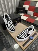 Amiri Skel Toe Slip-On Canvas Sneakers in Black and White