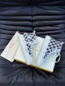 Amiri Skel Top High-Top Sneakers in Black and White.