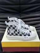 Amiri Skel Top High-Top Sneakers in Black and White.