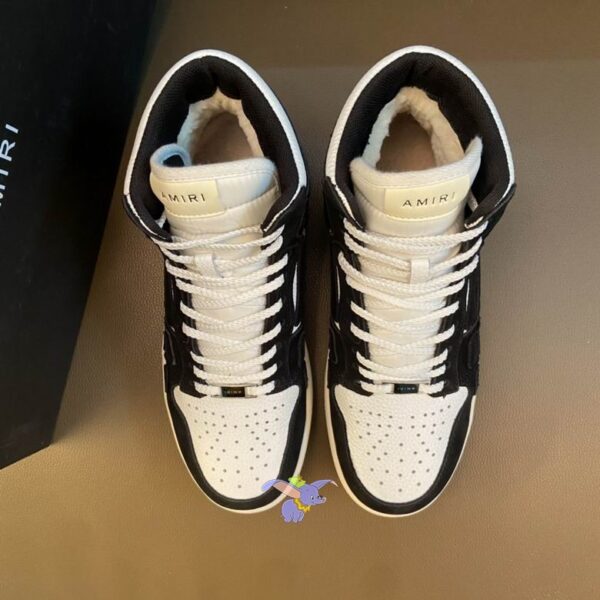 Amiri Skel Top High-Top Sneakers in Black and White Leather.