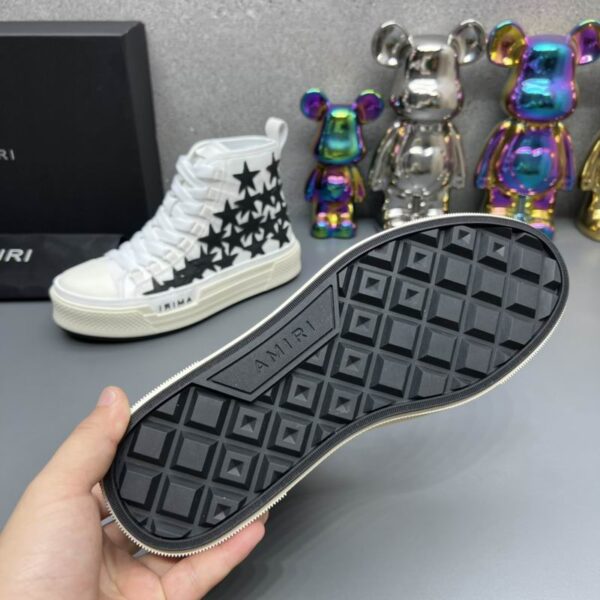 Amiri Skel Top High-Top Sneakers in White with Black Stars. - Image 6