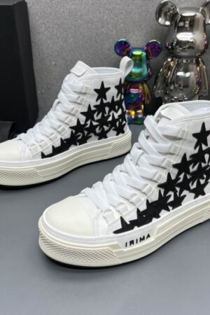 Amiri Skel Top High-Top Sneakers in White with Black Stars.