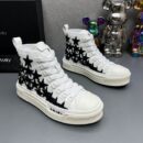 Amiri Skel Top High-Top Sneakers in White with Black Stars.