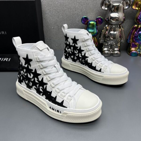 Amiri Skel Top High-Top Sneakers in White with Black Stars. - Image 3