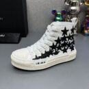 Amiri Skel Top High-Top Sneakers in White with Black Stars.