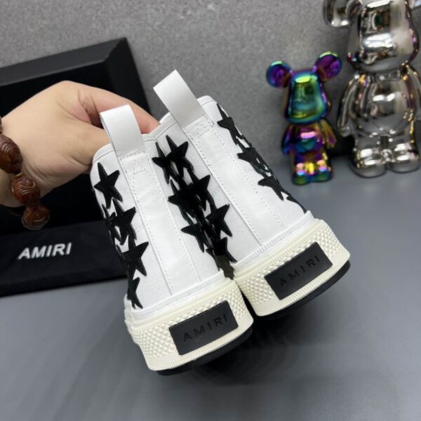 Amiri Skel Top High-Top Sneakers in White with Black Stars. - Image 5