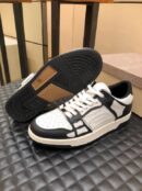 Amiri Skel-Top Low-Top Sneakers in Black and White.