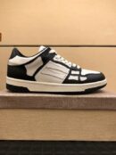 Amiri Skel-Top Low-Top Sneakers in Black and White.