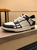 Amiri Skel-Top Low-Top Sneakers in Black and White.