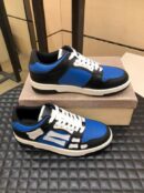 Amiri Skel-Top Low-Top Sneakers in Blue and Black.