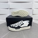 Amiri Skel-Top Slip-On Sneakers in Black and White.