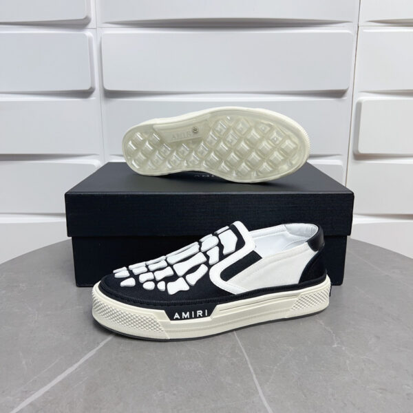 Amiri Skel-Top Slip-On Sneakers in Black and White. - Image 2