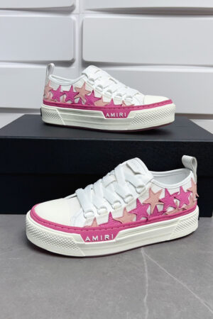 Amiri Star Court Low-Top Sneakers in Pink and White.