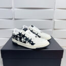 Amiri Stars Court Low-Top Sneakers in White with Black Stars.