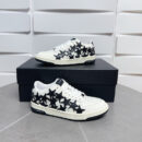 Amiri Stars Court Low-Top Sneakers in White with Black Stars.