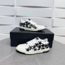 Amiri Stars Court Low-Top Sneakers in White with Black Stars.