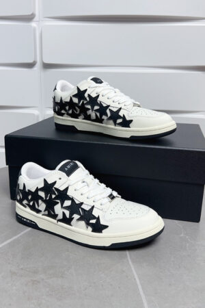 Amiri Stars Court Low-Top Sneakers in White with Black Stars.