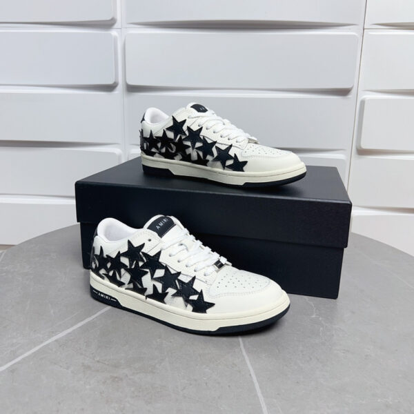 Amiri Stars Court Low-Top Sneakers in White with Black Stars.