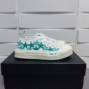 Amiri Stars Court Low-Top Sneakers in White with Green Stars.