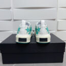 Amiri Stars Court Low-Top Sneakers in White with Green Stars.