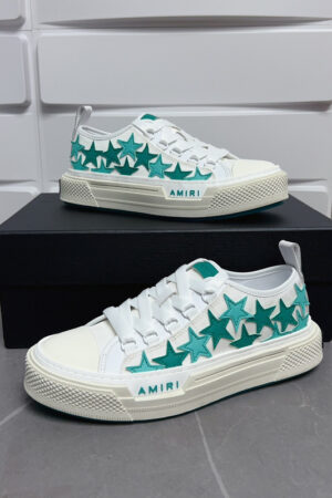 Amiri Stars Court Low-Top Sneakers in White with Green Stars.