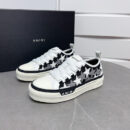 Amiri Stars Court Sneakers in White with White & Gray Stars.