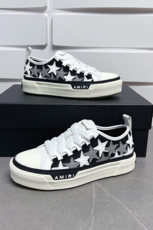 Amiri Stars Court Sneakers in White with White & Gray Stars.