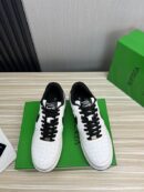 Bottega Veneta White Woven Low-Top Sneaker with Black Accents.