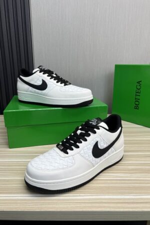 Bottega Veneta White Woven Low-Top Sneaker with Black Accents.