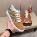 Dior Low-Top Sneaker in Tan/Brown, White and Gray Patterns.