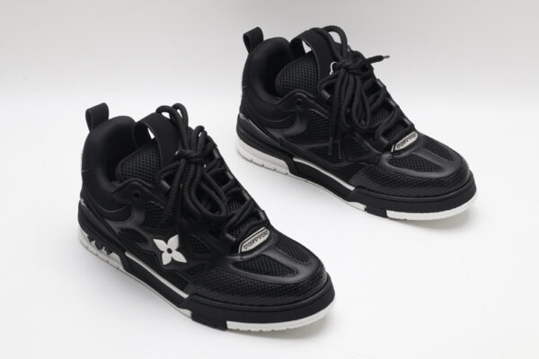 A pair of black Louis Vuitton LV Trainer sneakers