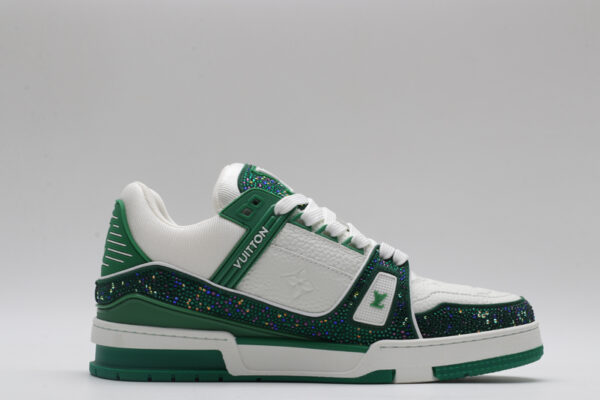 A pair of navy blue and silver Louis Vuitton LV Trainer sneakers, showcasing their bicolor design, textured panels, and robust outsole with "VUITTON" branding.