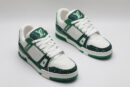 A single white and green Louis Vuitton LV Trainer sneaker, covered in glittering green crystal embellishments, with "VUITTON" written on the side strap
