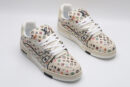 A single beige Louis Vuitton LV Trainer Low-Top Sneaker with an all-over multi-color Louis Vuitton Monogram pattern, showcasing its detailed design and white sole.