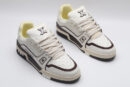 A single white Louis Vuitton LV Trainer Low-Top Sneaker, showcasing its embossed monogram on white leather and brown accents.