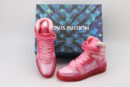 A pair of translucent pink Louis Vuitton LV Trainer Up high-top sneakers with velcro straps, light pink laces, and a pink sole