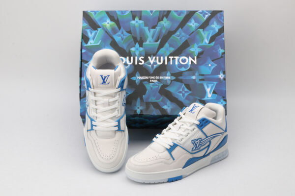A pair of white and blue Louis Vuitton LV Trainer sneakers with clear sole elements revealing LV monograms