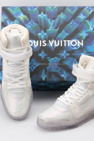 A pair of transparent white Louis Vuitton LV Trainer high-top sneakers with clear velcro straps and a chunky white sole