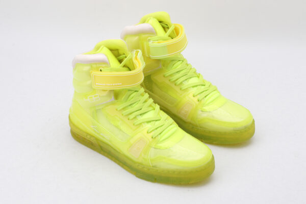 A single LuminousHi Neon Yellow High-Top Sneaker, shown in profile, featuring a translucent neon yellow upper, white padded collar, white laces, a translucent Velcro ankle strap, and a translucent neon yellow outsole.