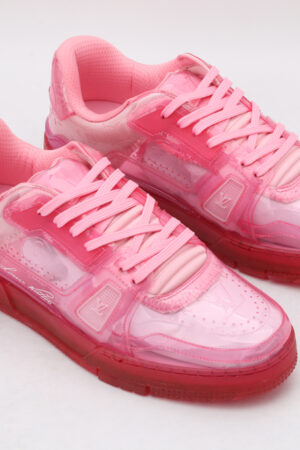 A pair of vibrant translucent pink low-top sneakers with matching laces and a clear pink sole, displayed against a clean white background.