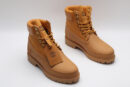 A single classic tan Timberland x Louis Vuitton collaborative waterproof boot, featuring the Timberland tree logo and subtle Louis Vuitton monogram debossing on the side.