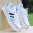 A low-top unisex sneaker with a simple design and a two-toned color scheme, available in black and white, or light blue and white.