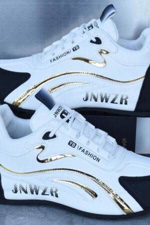 A pair of unisex casual sneakers with a white base, an athletic design, and a shiny gold stripe on the side.