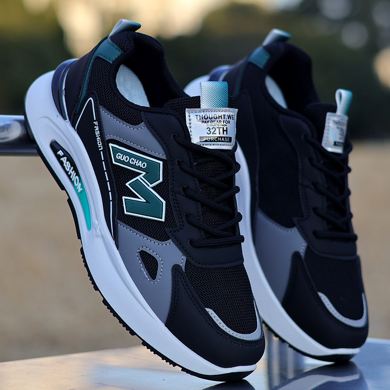 A pair of black and white unisex trainers with a sleek, minimalist design, featuring a smooth upper and the FKY brand logo on the side.