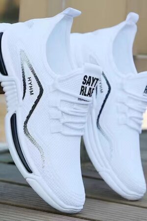 A pair of black and white unisex fashion trainers with a knitted "flying woven" upper and a thick, layered sole, featuring the brand name SUIQIAO.