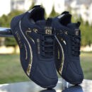 A pair of black, gray, white, and red unisex fashion sneakers with a multi-paneled upper and a chunky, sculpted sole.