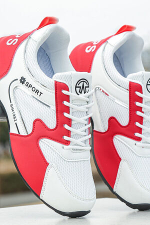 A pair of black and white unisex sneakers with a chunky, sculpted sole and the SIN1982 brand logo on the side.