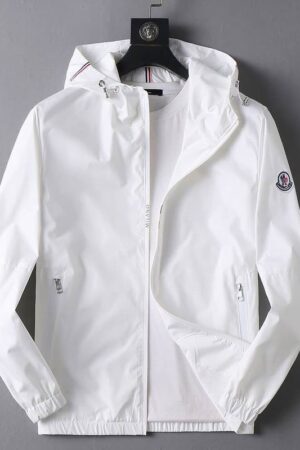 White lightweight nylon Moncler hooded windbreaker jacket with a full zip closure, zippered pockets, and the classic Moncler logo patch on the left sleeve.