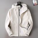 White GORE-TEX Moncler hooded technical jacket with black zipper and stripe featuring '#MONCLER' text. GORE-TEX logo appears on the sleeve.