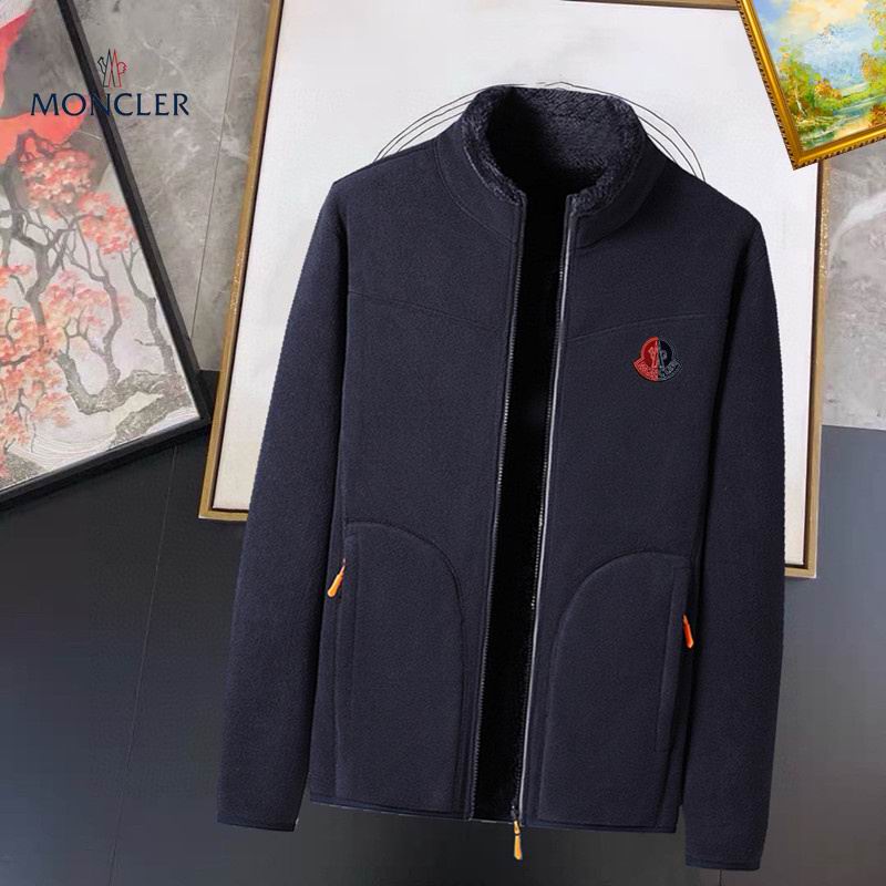 A simple Moncler fleece jacket, medium weight, featuring a full zip closure and the Moncler logo patch on the chest.